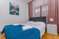 Posteľ alebo postele v izbe v ubytovaní Apartments Tabak