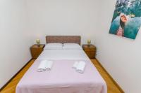 Posteľ alebo postele v izbe v ubytovaní Apartments Tabak