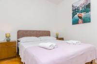 Posteľ alebo postele v izbe v ubytovaní Apartments Tabak