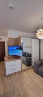 TV a/nebo společenská místnost v ubytování Studio CASCADAS FAMILY RESORT