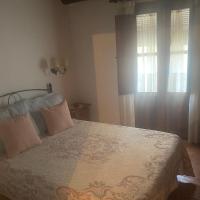 A bed or beds in a room at Casa rural La Aldea
