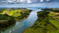 an aerial view of a river with boats in it at TY COAT - Maison neuve avec vue mer, piscine et bain nordique in Saint-Pabu