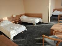 Posteľ alebo postele v izbe v ubytovaní Hotel Olimpijski