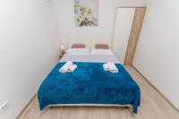 Posteľ alebo postele v izbe v ubytovaní Apartments Tabak