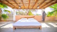 A bed or beds in a room at Villa Domino Ibiza
