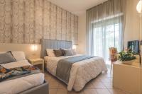Posteľ alebo postele v izbe v ubytovaní Hotel Athena