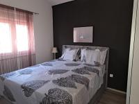 Posteľ alebo postele v izbe v ubytovaní Apartmani Zoran