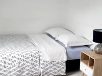 Łóżko lub łóżka w pokoju w obiekcie Joli appartement proche Paris Orly - Climatisé