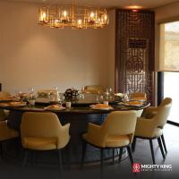 a dining room with a large table and chairs at Acro Residences in Guiguinto
