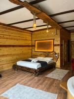 A bed or beds in a room at Esinti Bungalows Otel