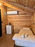 A bed or beds in a room at Esinti Bungalows Otel