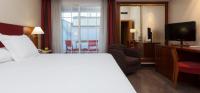 A bed or beds in a room at URH Ciutat de Mataró