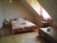 Postel nebo postele na pokoji v ubytování Tõnise Holiday Houses