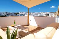 a balcony with a view of a city at Vejerísimo Casa Boutique in Vejer de la Frontera