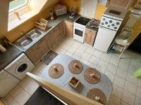 an overhead view of a kitchen with a table at LES FLORALIES in Froberville