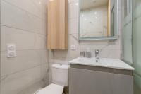 a white bathroom with a toilet and a sink at Hamac Suites - Monplaisir fully equipped studio-2p in Lyon