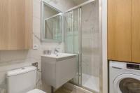 a bathroom with a sink and a washing machine at Hamac Suites - Monplaisir fully equipped studio-2p in Lyon