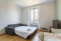 a small bedroom with a bed and a window at Hamac Suites - Monplaisir fully equipped studio-2p in Lyon