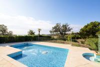 a swimming pool in the middle of a yard at Les Issambres Corniche - maeva Home - Appartement 2 pièces 6 personnes Séle 78 in Les Issambres