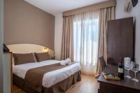 Łóżko lub łóżka w pokoju w obiekcie Hotel La Pergola