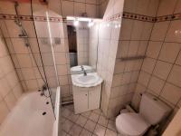 a bathroom with a sink and a toilet and a shower at Résidence Chaviere - Studio pour 2 Personnes 034 in Les Menuires