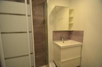 a bathroom with a toilet and a sink and a shower at Résidence Villaret - Studio pour 4 Personnes 194 in Les Menuires