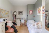 a bedroom with a bed with stuffed animals on it at Résidor - Spacious and bright apartment ! in Levallois-Perret