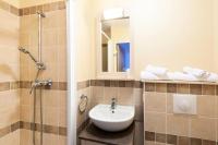 a bathroom with a sink and a shower with a mirror at Les Coteaux de Pont Royal en Provence - maeva Home - Appartement 3 pièces 6 214 in Mallemort