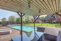 a patio with a table and chairs and a swimming pool at Gîte de France Bayat 4 épis - Gîte de France 5 personnes 354 in Varetz