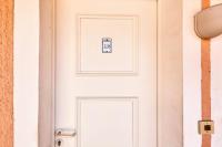 a white door with a sign on it at Résidence le Village de Cap Esterel - maeva Home - Appartement 2 pièces 6 p 26 in Saint-Raphaël