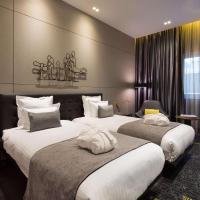 Een bed of bedden in een kamer bij art'otel amsterdam, Powered by Radisson Hotels