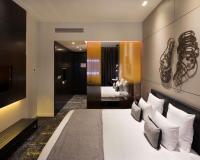 Een bed of bedden in een kamer bij art'otel amsterdam, Powered by Radisson Hotels