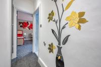 a wall mural of flowers on a wall at *RA10W* For your most relaxed &amp; Cosy stay + Free Parking + Free Fast WiFi * in Belle Isle