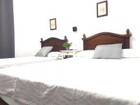 Posteľ alebo postele v izbe v ubytovaní Hostal Cuzco