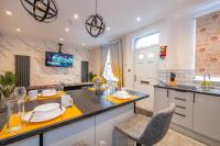 a kitchen with a table and chairs in it at *RB10W* For your most relaxed &amp; Cosy stay + Free Parking + Free Fast WiFi * in Belle Isle