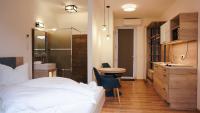A bed or beds in a room at Napsugár Club és Panzió