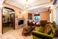 a living room with a couch and a fireplace at Xin Yuan My Dream Castle in Dongshan