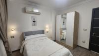 Postel nebo postele na pokoji v ubytování Madinaty apartment 1 شقة فندقية مفروشة سوبر لوكس في مدينتي