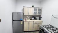 Kuchyň nebo kuchyňský kout v ubytování Madinaty apartment 1 شقة فندقية مفروشة سوبر لوكس في مدينتي