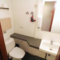 a bathroom with a toilet and a sink at Forenom Aparthotel Lahti in Lahti