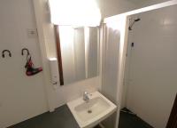 a bathroom with a sink and a mirror at Forenom Aparthotel Lahti in Lahti