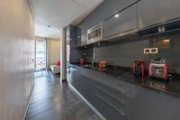 A kitchen or kitchenette at Cituspace Sandoval