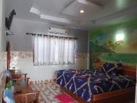 Postel nebo postele na pokoji v ubytování สิชล บ้านอุ๊ รีสอร์ท