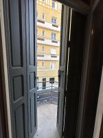 an open door with a view of a building at Charmant Studio avec Balcon in Perpignan