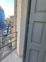 a door to a balcony with a parking lot at Charmant Studio avec Balcon in Perpignan