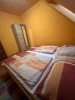 Posteľ alebo postele v izbe v ubytovaní Jola Apartman