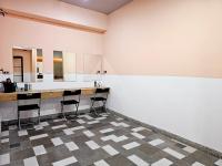 a bathroom with a counter and stools in a room at Meeting Mates Hostel in Taipei