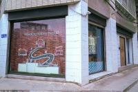 a window of a store with a snake in it at Meeting Mates Hostel in Taipei