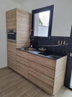 a kitchen with a sink and a window at Le Cocoon in Carpentras