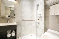 a bathroom with a shower and a sink at Cityinn Hotel Taipei Station Branch I in Taipei